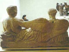 Banqueter and Vanth, Limestone Cinerary Urn, back view.