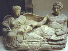 Banqueter and Vanth, Limestone Cinerary Urn, 400 B.C.