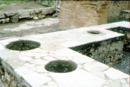 A thermopolium (tavola calda or luncheonette) on Via dell'Abbondanza