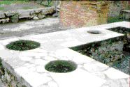 A thermopolium (tavola calda or luncheonette) on Via dell'Abbondanza